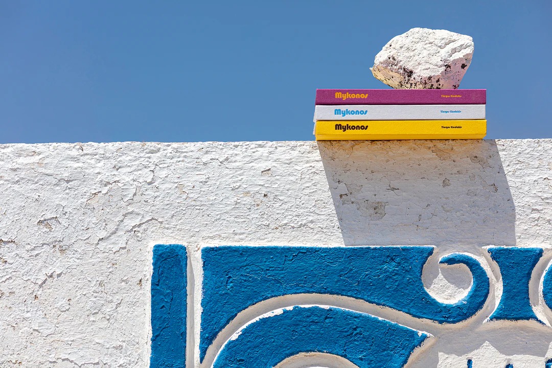 Stacked books on stone ledge
